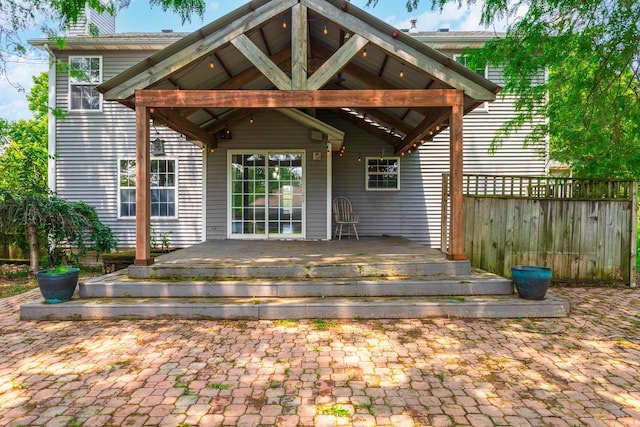 102 Merganser Ct, Downs, IL 61736 - back of property with a chimney and a deck