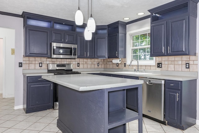 102 Merganser Ct, Downs, IL 61736 - kitchen with appliances with stainless steel finishes, a sink, light countertops, light tile patterned flooring, and ornamental molding