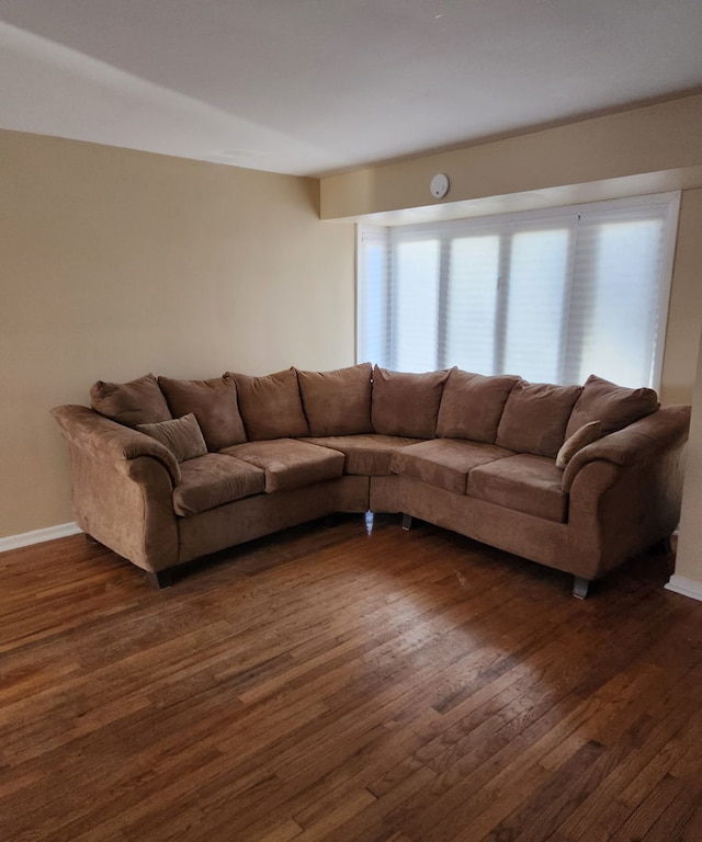 living room with dark wood-style floors and baseboards