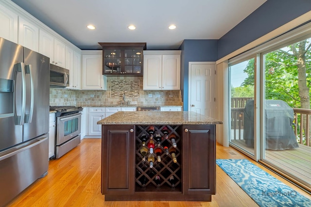 155 Willow Blvd, Willow Springs, IL 60480 - kitchen with stainless steel appliances, white cabinetry, healthy amount of natural light, light wood-style floors, and recessed lighting