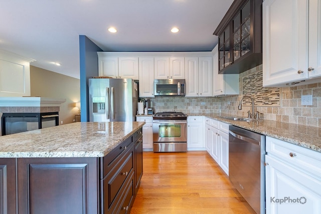 155 Willow Blvd, Willow Springs, IL 60480 - kitchen with stainless steel appliances, a sink, white cabinetry, and recessed lighting