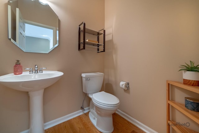 155 Willow Blvd, Willow Springs, IL 60480 - bathroom with toilet, wood finished floors, baseboards, and a sink