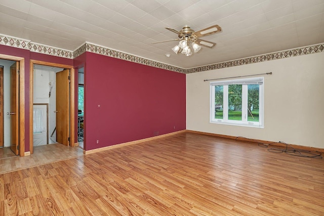 302 Wabash Ave, Campus, IL 60920 - unfurnished room featuring light wood-style floors, ceiling fan, and baseboards