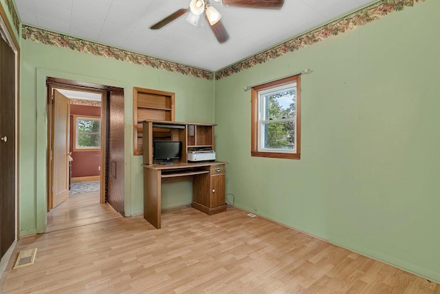 302 Wabash Ave, Campus, IL 60920 - kitchen featuring plenty of natural light, a ceiling fan, light wood finished floors, and a desk
