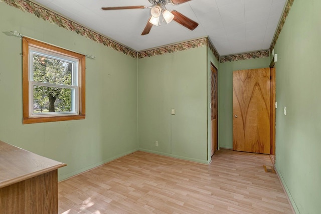 302 Wabash Ave, Campus, IL 60920 - empty room with light wood-style flooring, ceiling fan, and baseboards