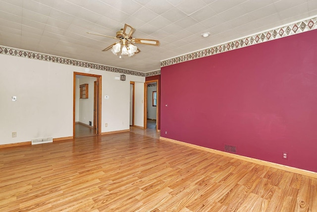 302 Wabash Ave, Campus, IL 60920 - unfurnished room with wood finished floors, ceiling fan, and baseboards