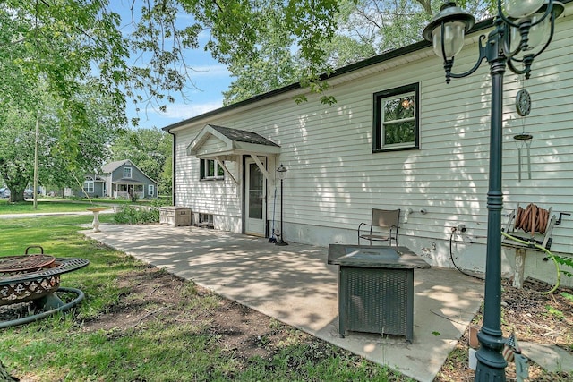 302 Wabash Ave, Campus, IL 60920 - rear view of house featuring a patio area and a yard