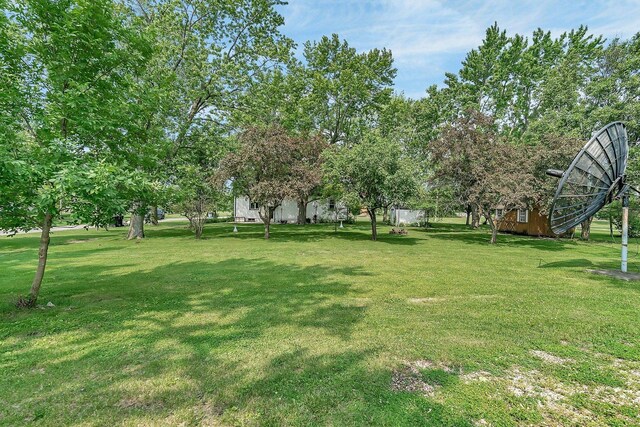 302 Wabash Ave, Campus, IL 60920 - view of green lawn featuring an outbuilding