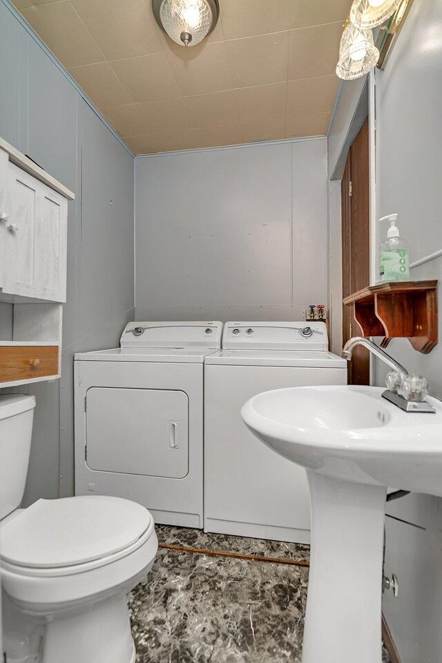 302 Wabash Ave, Campus, IL 60920 - bathroom with separate washer and dryer, toilet, and a sink