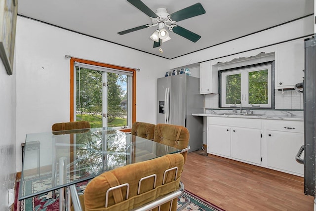 302 Wabash Ave, Campus, IL 60920 - dining room featuring healthy amount of natural light, a ceiling fan, and light wood-style floors