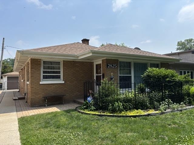 2825 N Indian Boundary Rd, River Grove, IL 60171 - view of front of house with brick siding, a chimney, and roof with shingles