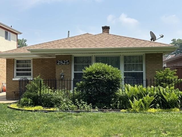2825 N Indian Boundary Rd, River Grove, IL 60171 - view of front of home featuring brick siding, a chimney, and roof with shingles