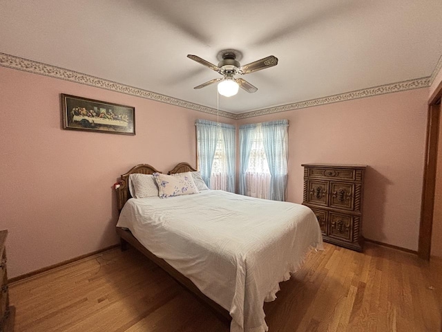 2825 N Indian Boundary Rd, River Grove, IL 60171 - bedroom with light wood finished floors, a ceiling fan, and baseboards