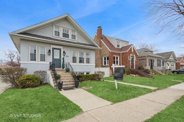3731 Maple Ave, Berwyn, IL 60402 - bungalow-style home featuring a front lawn and roof with shingles