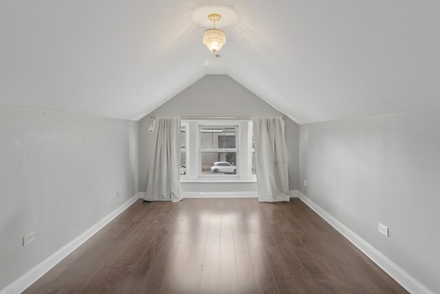 3731 Maple Ave, Berwyn, IL 60402 - additional living space with vaulted ceiling, wood finished floors, and baseboards