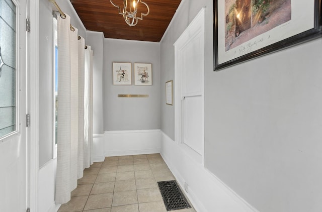 3731 Maple Ave, Berwyn, IL 60402 - hallway featuring light tile patterned flooring, wooden ceiling, and a chandelier