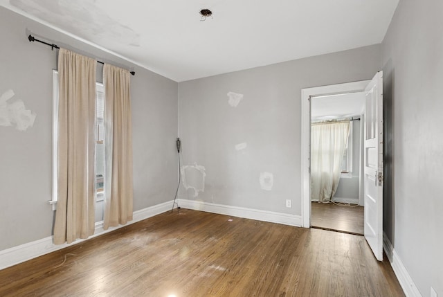 3731 Maple Ave, Berwyn, IL 60402 - spare room featuring wood finished floors and baseboards