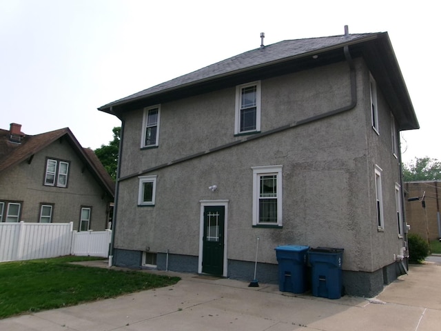 1023 Rock St, Peru, IL 61354 - rear view of property with a patio and stucco siding