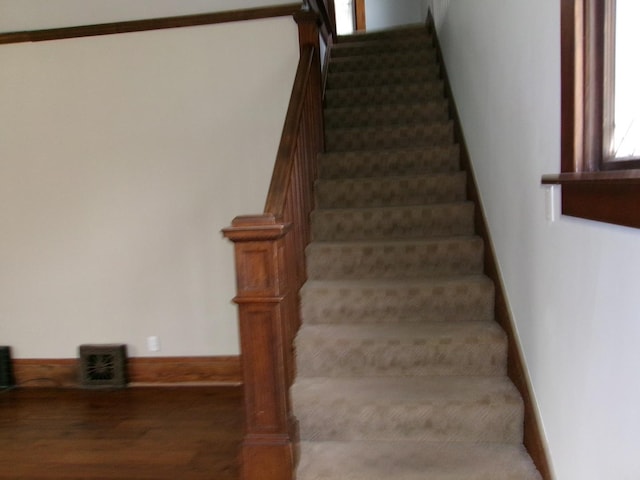 1023 Rock St, Peru, IL 61354 - stairs with wood finished floors and baseboards
