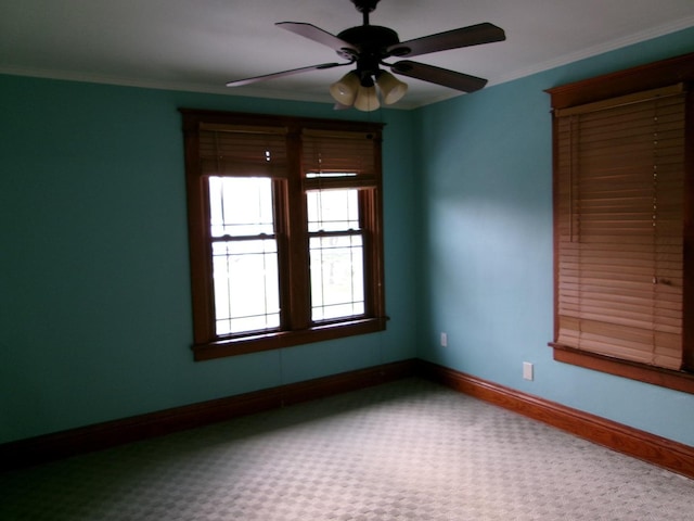 1023 Rock St, Peru, IL 61354 - empty room featuring carpet floors, ceiling fan, baseboards, and ornamental molding