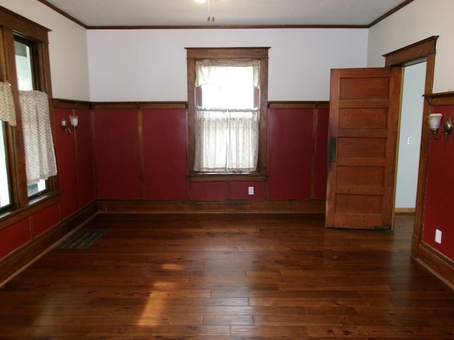 1023 Rock St, Peru, IL 61354 - empty room featuring ornamental molding, hardwood / wood-style floors, and a wainscoted wall