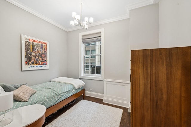 210 E Pearson St Unit 11A, Chicago, IL 60611 - bedroom with a chandelier, crown molding, wood finished floors, and baseboards