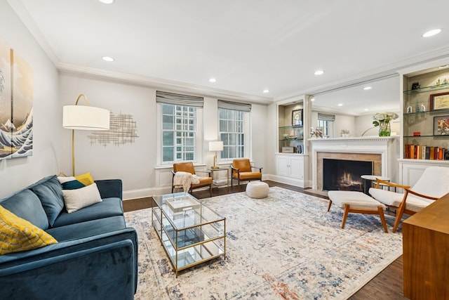 210 E Pearson St Unit 11A, Chicago, IL 60611 - living room featuring wood finished floors, recessed lighting, ornamental molding, a premium fireplace, and baseboards