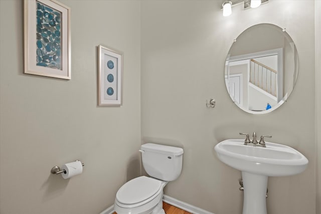 1809 Pembrook Ct, Plainfield, IL 60586 - bathroom with toilet, baseboards, and wood finished floors
