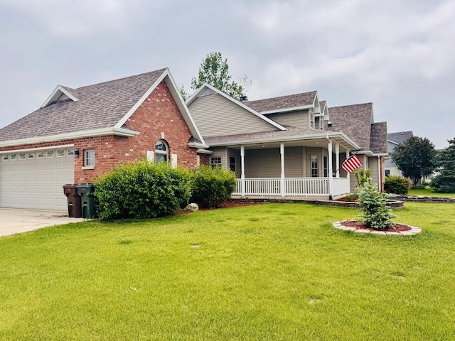 1102 Brian Dr, Manteno, IL 60950 - view of front of property with a porch, roof with shingles, an attached garage, a front lawn, and brick siding