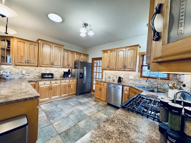 1102 Brian Dr, Manteno, IL 60950 - kitchen featuring stainless steel appliances, tasteful backsplash, and healthy amount of natural light
