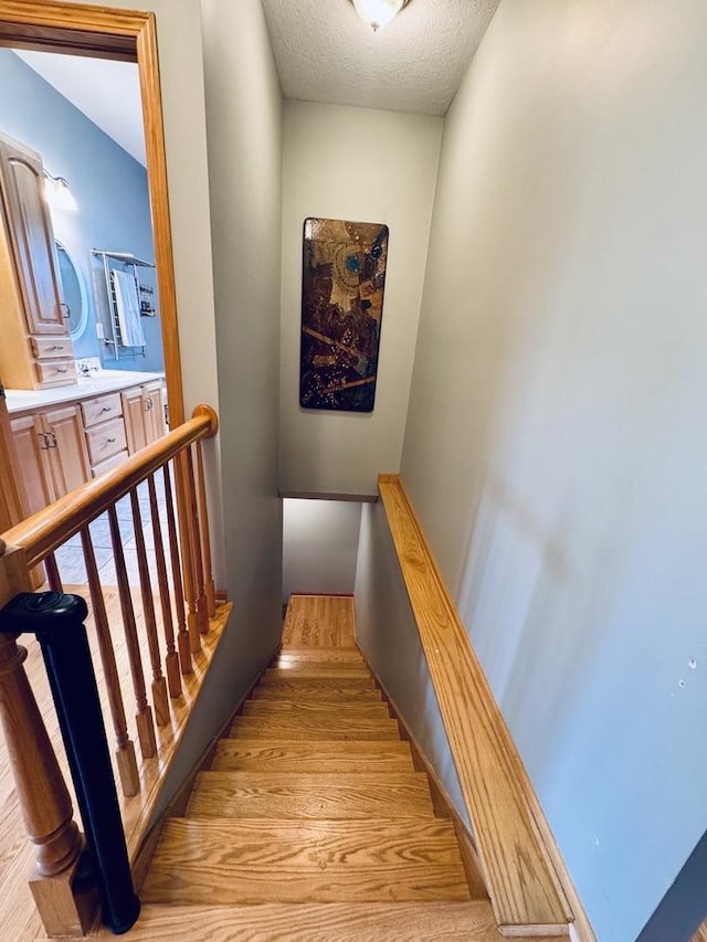 1102 Brian Dr, Manteno, IL 60950 - stairway featuring a textured ceiling