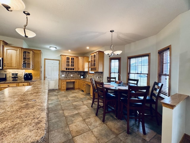 1102 Brian Dr, Manteno, IL 60950 - dining area featuring light stone finish floors and recessed lighting