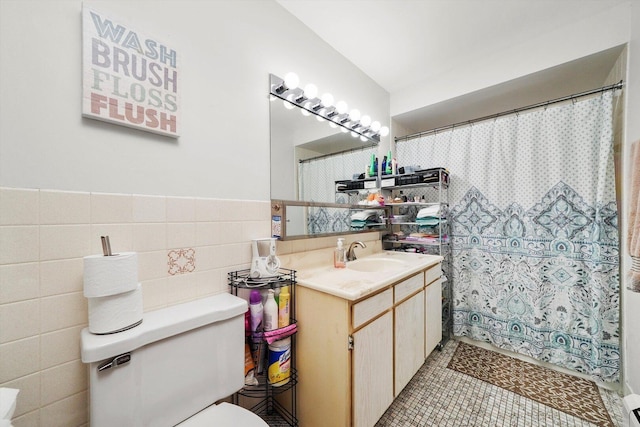 6568 W Roscoe St Unit 2N, Chicago, IL 60634 - bathroom featuring toilet, vanity, tile walls, curtained shower, and tile patterned floors