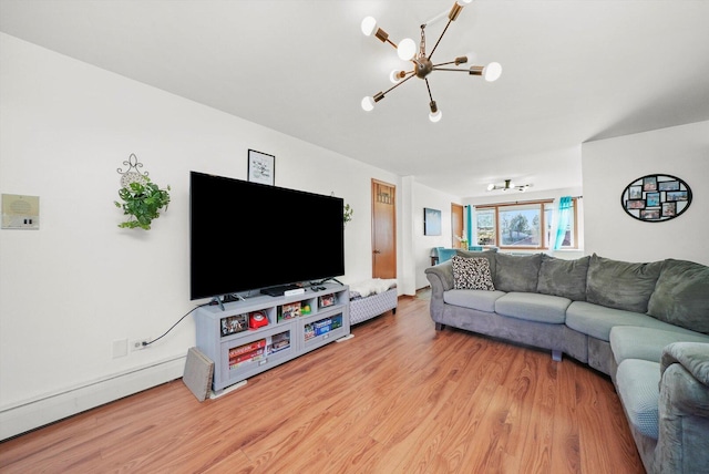 6568 W Roscoe St Unit 2N, Chicago, IL 60634 - living room featuring a chandelier, light wood finished floors, and a baseboard heating unit