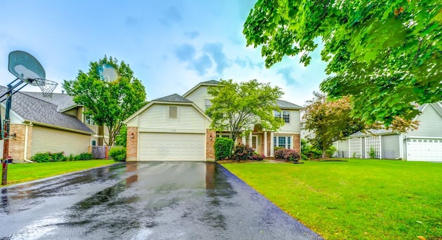 713 Warwick Ln, Lake Zurich, IL 60047 - view of front facade featuring brick siding, a front lawn, and driveway