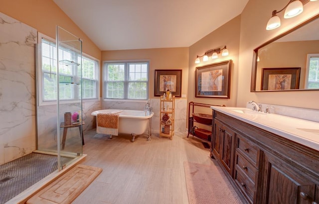 713 Warwick Ln, Lake Zurich, IL 60047 - bathroom featuring tile walls, wood finished floors, a freestanding tub, double vanity, and a marble finish shower