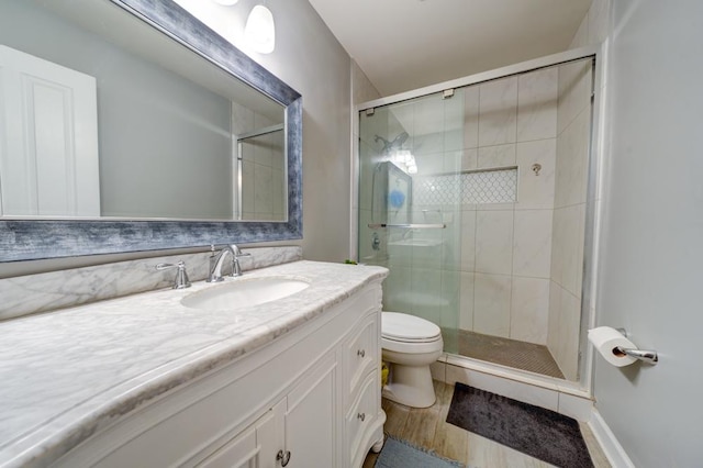 713 Warwick Ln, Lake Zurich, IL 60047 - full bathroom with vanity, toilet, a shower stall, and wood finished floors