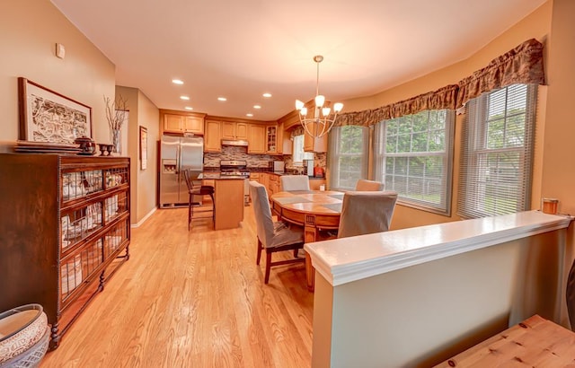 713 Warwick Ln, Lake Zurich, IL 60047 - dining area featuring light wood finished floors, a chandelier, recessed lighting, and baseboards