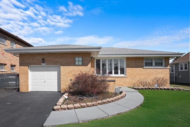 8014 W Summerdale Ave, Chicago, IL 60656 - single story home featuring brick siding, a garage, asphalt driveway, a front yard, and roof with shingles