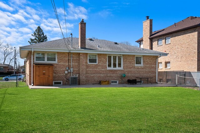 8014 W Summerdale Ave, Chicago, IL 60656 - back of property featuring a patio, brick siding, a chimney, and a shingled roof