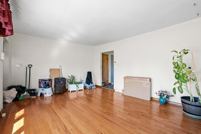 8014 W Summerdale Ave, Chicago, IL 60656 - miscellaneous room with wood finished floors
