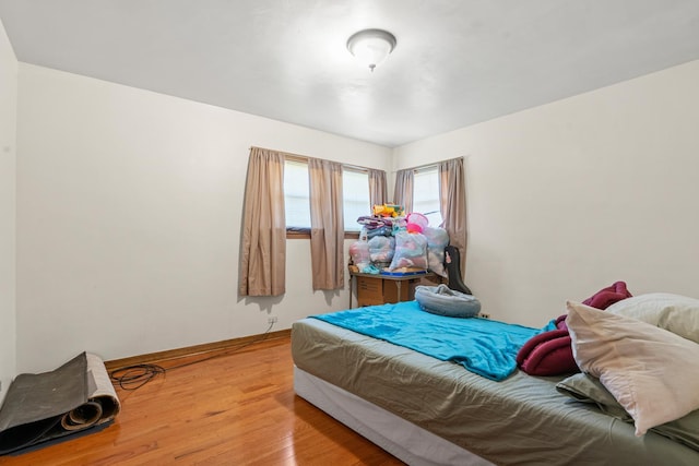 8014 W Summerdale Ave, Chicago, IL 60656 - bedroom featuring light wood finished floors and baseboards