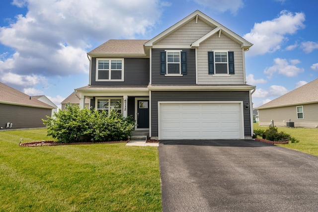 6712 Eich Dr, Joliet, IL 60431 - craftsman-style home featuring an attached garage, a front lawn, driveway, and cooling unit