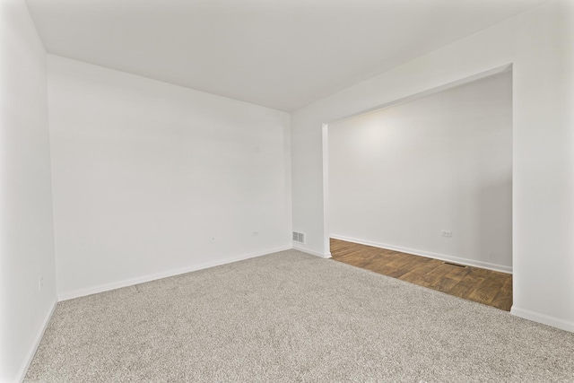 6712 Eich Dr, Joliet, IL 60431 - empty room with dark colored carpet and baseboards
