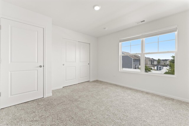 6712 Eich Dr, Joliet, IL 60431 - unfurnished bedroom with carpet floors, baseboards, and a closet