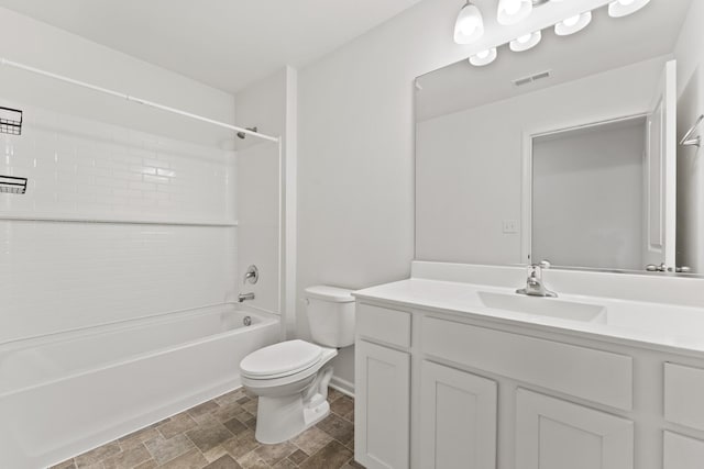 6712 Eich Dr, Joliet, IL 60431 - full bath featuring toilet, vanity,  shower combination, and stone finish flooring