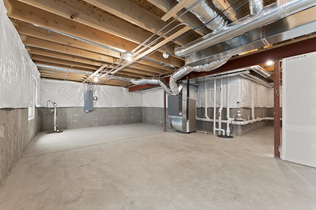 6712 Eich Dr, Joliet, IL 60431 - unfinished below grade area with electric panel, heating unit, and drainage system