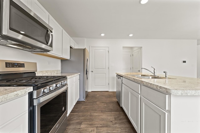 6712 Eich Dr, Joliet, IL 60431 - kitchen with stainless steel appliances, a sink, recessed lighting, dark wood-style floors, and white cabinets