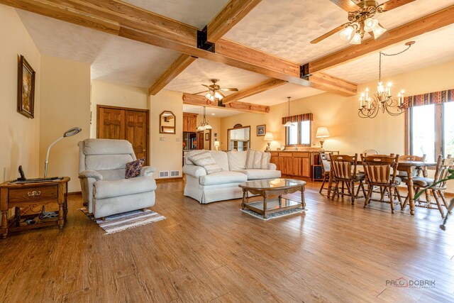 3206 Turnberry Dr, Mchenry, IL 60050 - living area with ceiling fan, plenty of natural light, wood finished floors, and beam ceiling