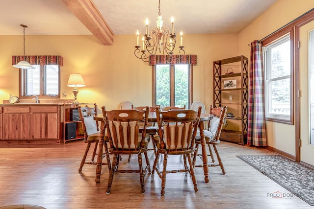 3206 Turnberry Dr, Mchenry, IL 60050 - dining area featuring a chandelier, light wood-type flooring, plenty of natural light, beam ceiling, and baseboards